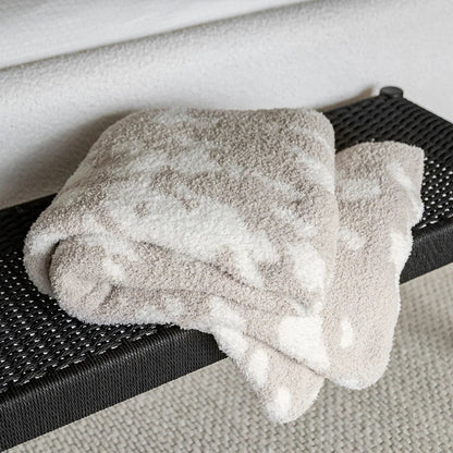 Jeté allongé imprimé vache beige rougissant et blanc