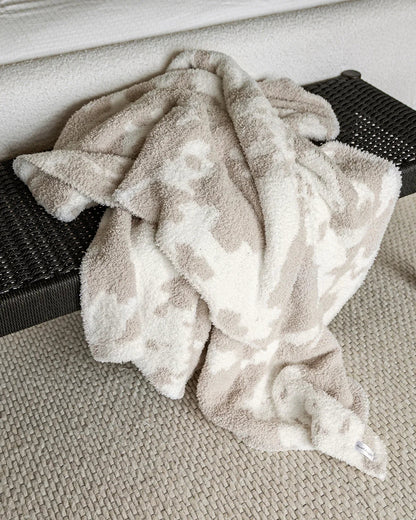 Jeté allongé imprimé vache beige rougissant et blanc