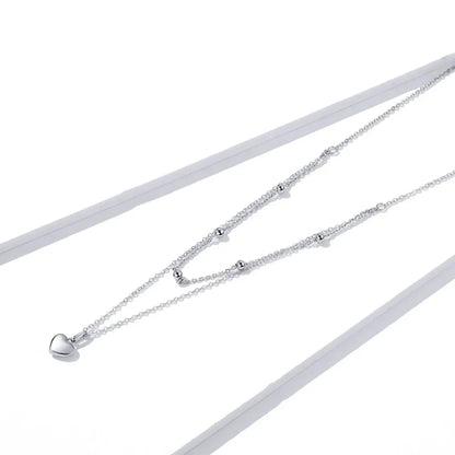 Collier ras de cou avec pendentif double cœur en argent sterling 925